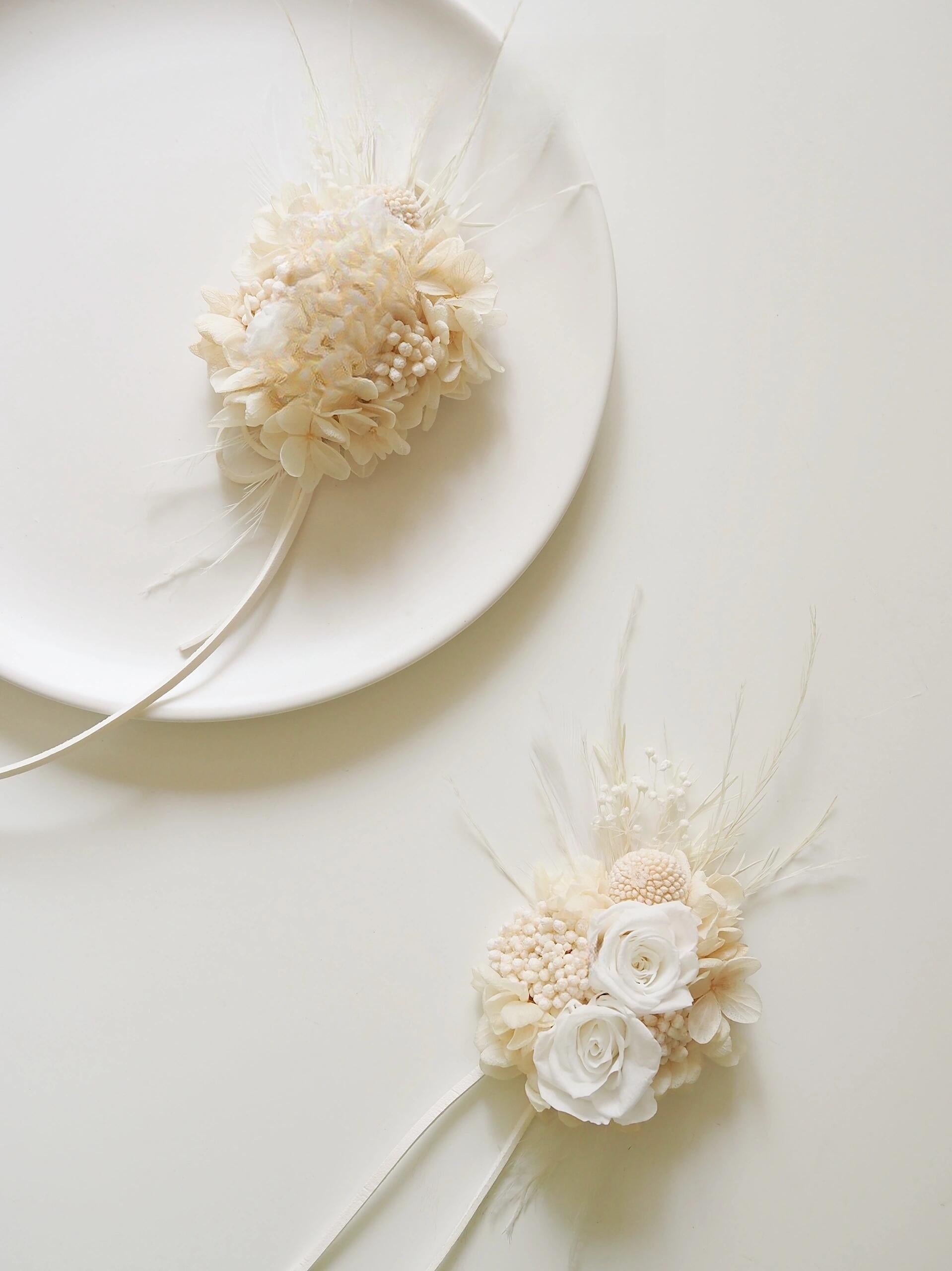 Long-lasting preserved flower corsage with ivory roses and hydrangeas
