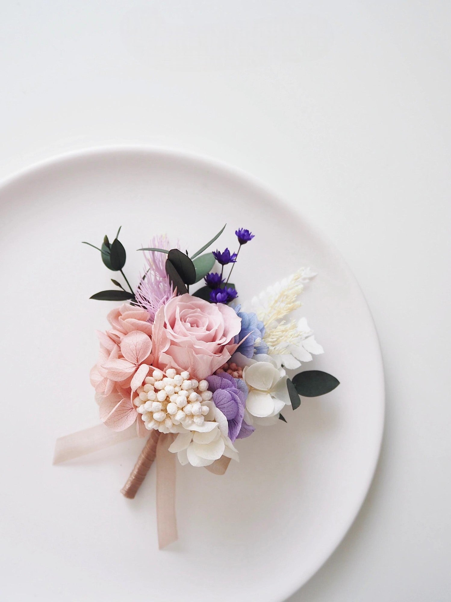 Romantic wedding boutonniere and corsage set with blush roses and lilac hydrangeas
